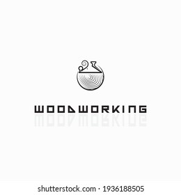 
an illustration consisting of an image of a planer plowing a tree and the inscription "woodworking"