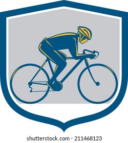 Illustration of a cyclist biking riding mountain bike facing side set inside shield on isolated background done in retro style. 