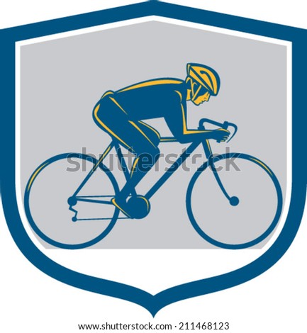 Illustration of a cyclist biking riding mountain bike facing side set inside shield on isolated background done in retro style. 