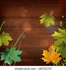 The illustration of  dark wooden texture with maple leaves. Vector image 