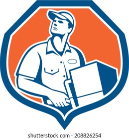 Illustration of a delivery worker delivering parcel package carton box showing on a dolly hand trolley set inside shield crest on isolated background done in retro style.