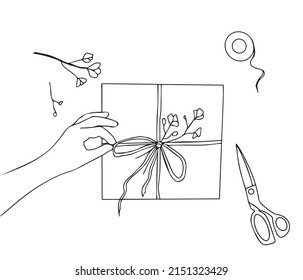 Ilustración que muestra el proceso de envolver un regalo para la festividad. Paquetes de mano una caja de regalo