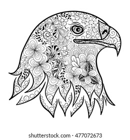 Illustration "Eagle head" was created in doodling style in black and white colors.  Painted image is isolated on white background. It  can be used for coloring books for adult.
