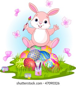 Illustration of Easter bunny sitting on eggs  and butterflies in a spring theme.