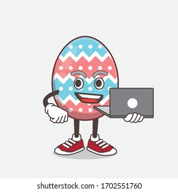 An illustration of Easter Egg cartoon mascot character working with laptop