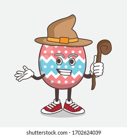 An illustration of Easter Egg cartoon mascot character as a witch wearing hat and staff