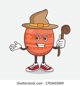 An illustration of Easter Egg cartoon mascot character as a witch wearing hat and staff