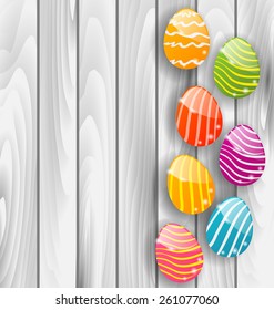 Illustration Easter glossy colorful eggs on grey wooden texture - vector