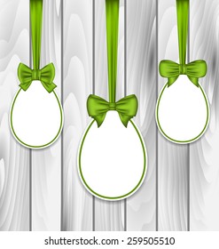 Illustration Easter three papers eggs wrapping green bows on grey wooden background - vector