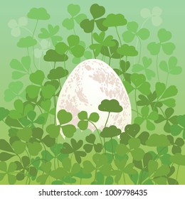 Illustration of an egg in green clovers