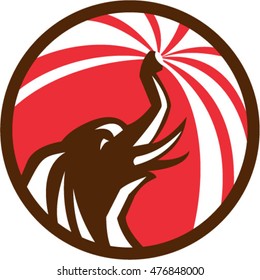 Illustration of an elephant bathing water from trunk viewed from the side set  inside circle done in retro style. 