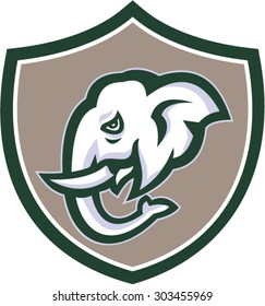 Illustration of an elephant head with tusk viewed from the side set inside shield crest on isolated background done in retro style.