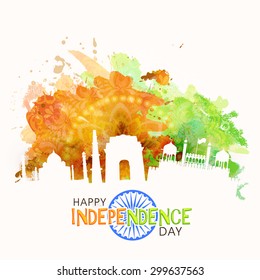 Illustration of famous Indian monuments on saffron and green color splash floral background for Happy Independence Day celebration.