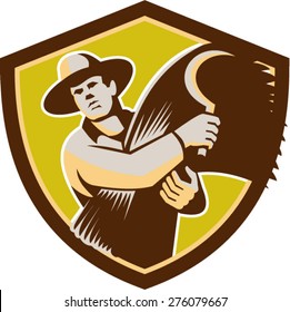 Illustration of a farmer farm worker holding scythe and wheat harvest facing front set inside shield crest on isolated background done in retro style.