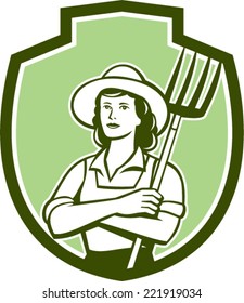 Illustration of a female organic farmer with pitchfork with hat facing front set inside shield crest on isolated bakcground done in retro style.