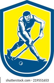 Illustration of a field hockey player running with stick striking ball set inside oval shape done in retro woodcut style on isolated background.