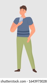 Illustration of a full-length young man who is looking at the phone. A man holds his hand in his trouser pocket. Vector. Flat cartoon style. Isolated on white background