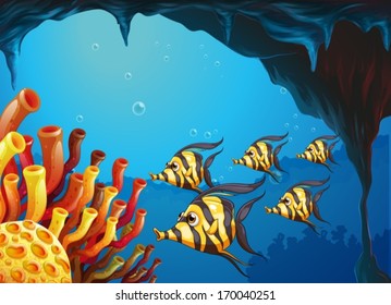 Illustration of a group of striped-colored fishes near the coral reefs