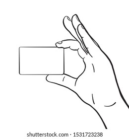 illustration of a hand holding a card between forefinger and thumb. credit card, membership card, loyalty card, outline, vector.