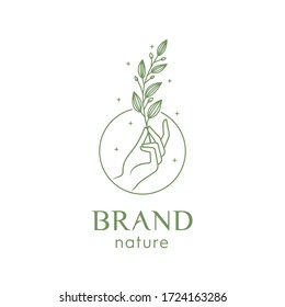 Illustration Of A Hand Holding A Leaf For Logo Premium Vector