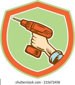Illustration of a handyman carpenter builder hand holding a cordless drill set inside shield crest shape isolated on white done in retro woodcut style.