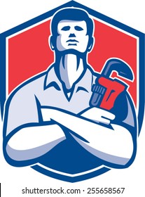 Illustration of a handyman plumber repairman worker arms folded holding monkey wrench viewed from front set inside shield crest on isolated background done in retro style.