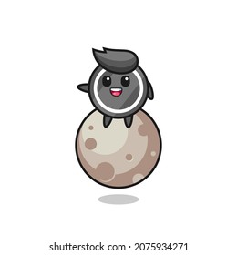 illustration of hockey puck cartoon sitting on the moon , cute style design for t shirt, sticker, logo element
