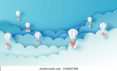 Illustration of hot air balloon with gift box float up to the cloudy sky. paper art of hot air balloon with gift box. paper cut and craft style. vector, illustration.