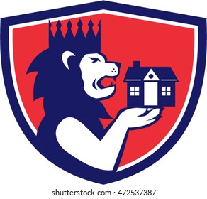 Illustration of a king lion with crown holding house with its paw viewed from the side set inside shield crest done in retro style. 