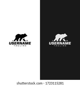 Illustration logo of a bear with its cubs on a black and white negative space.