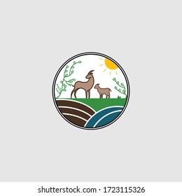 Illustration logo of a goat on a hill at sunset/sunrise.
