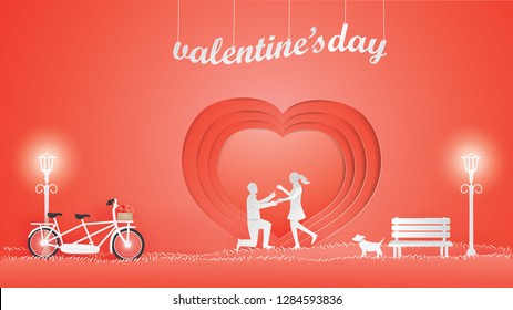 Illustration Of Love And Valentine Day With Couple Propose The Backdrop Is Heart Shaped In The Park.Valentine Day Concept,Paper Art Style Vector.