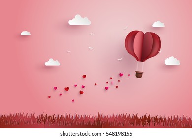 illustration of love and valentine day, love in shape of heart for greeting card, hot air balloon flying over grass with heart float on the sky.paper cut art and  digital craft style.