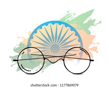 Illustration Of Mahatma Gandhi Spectacles On Indian Flag Color Background With Ashoka Chakra Design. 2nd Of October.