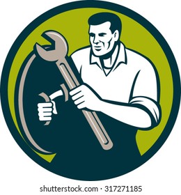 Illustration of a mechanic brandishing spanner wrench looking to the side viewed from front set inside circle on isolated background done in retro style. 