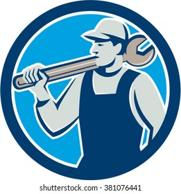 Illustration of a mechanic holding spanner on shoulder looking to the side set inside circle on isolated background done in retro style. 