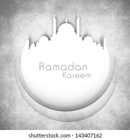 Illustration of mosque on grungy grey background with text Ramadan Kareem.