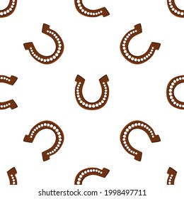 Illustration on theme Irish holiday St Patrick day, seamless horseshoes. Pattern St Patrick day consisting of identical horseshoes on white background. Horseshoes it main accessory for St Patrick day.