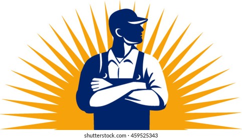 Illustration of an organic farmer wearing hat and overalls arms folded looking to the side viewed from front with sunburst in the background done in retro style. 