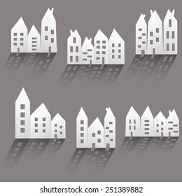Illustration of paper houses with long shadow
