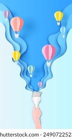 Illustration of person using a paint brush creative for art of sky with hot air Balloons. Paper art of Hot air balloon. paper cut and craft style. vector, illustration.