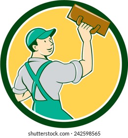 Illustration of a plasterer masonry tradesman construction worker standing with trowel looking to the side viewed from rear set inside circle on isolated background done in cartoon style. 