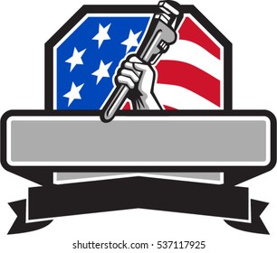 Illustration of a plumber hand holding adjustable pipe wrench viewed from the side set inside shield crest with usa american stars and stripes flag in the background done in retro style. 