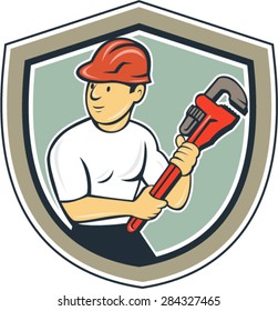 Illustration of a plumber with hardhat holding monkey wrench looking to the side set inside shield crest on isolated background done in cartoon style.