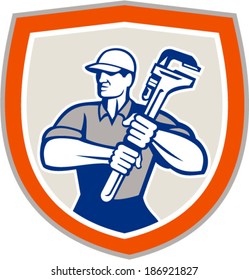 Illustration of a plumber holding a giant monkey wrench set inside shield facing front done in retro woodcut style on isolated background.