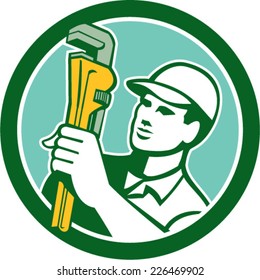 Illustration of a plumber holding monkey wrench looking to the side set inside circle on isolated background done in retro style. 