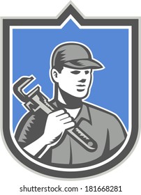 Illustration of a plumber with monkey wrench set inside shield facing front done in retro woodcut style on isolated background.