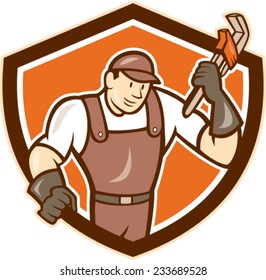 Illustration of a plumber in overalls and hat holding monkey wrench set inside shield crest on isolated background done in cartoon style.