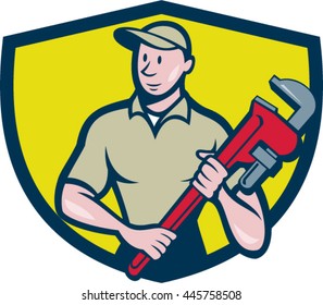 Illustration of a plumber in overalls and hat standing looking to the side holding monkey wrench viewed from front set inside shield crest on isolated background done in cartoon style.