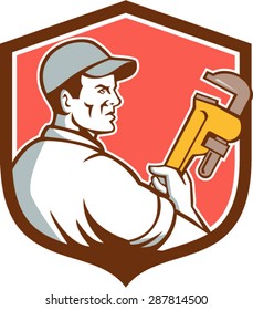 Illustration of a plumber wearing hat holding monkey wrench viewed from the side set inside shield crest on isolated background done in retro style. 